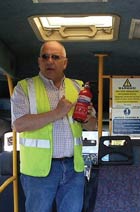 Image of a man doing Fire Extinguisher training.